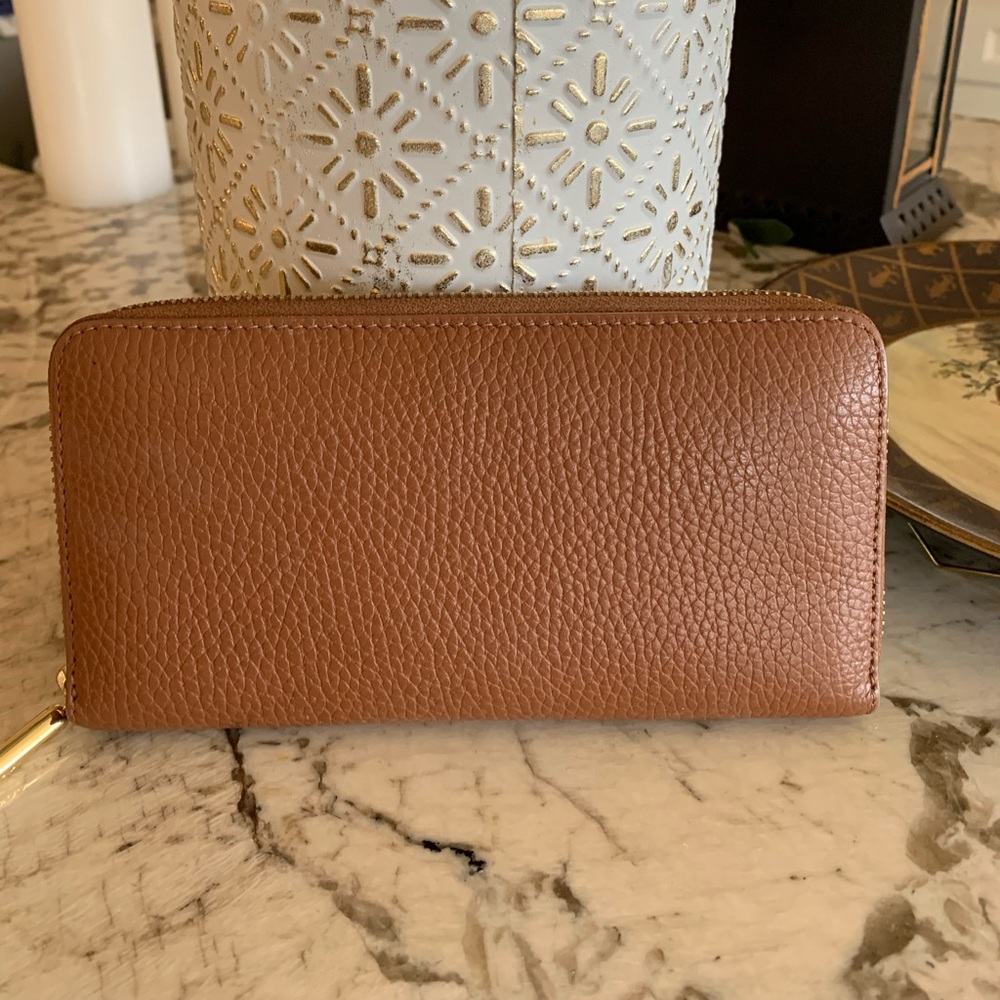 Cuyana zip around wallet. Caramel exterior with red interior.